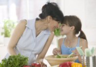 Photo of a woman and a child in the kitchen.