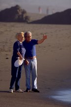 Photo of a man and woman on a beach.